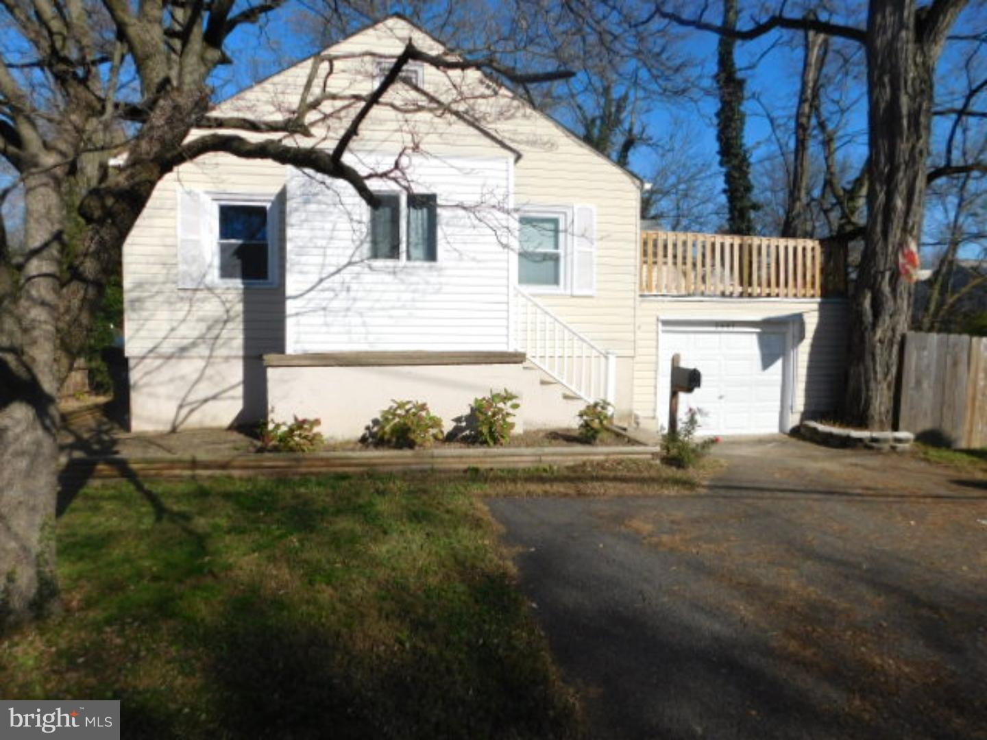 2447 Woodland Road Abington, PA 19001 - Photo 2 of 24 a front view of a house with garden