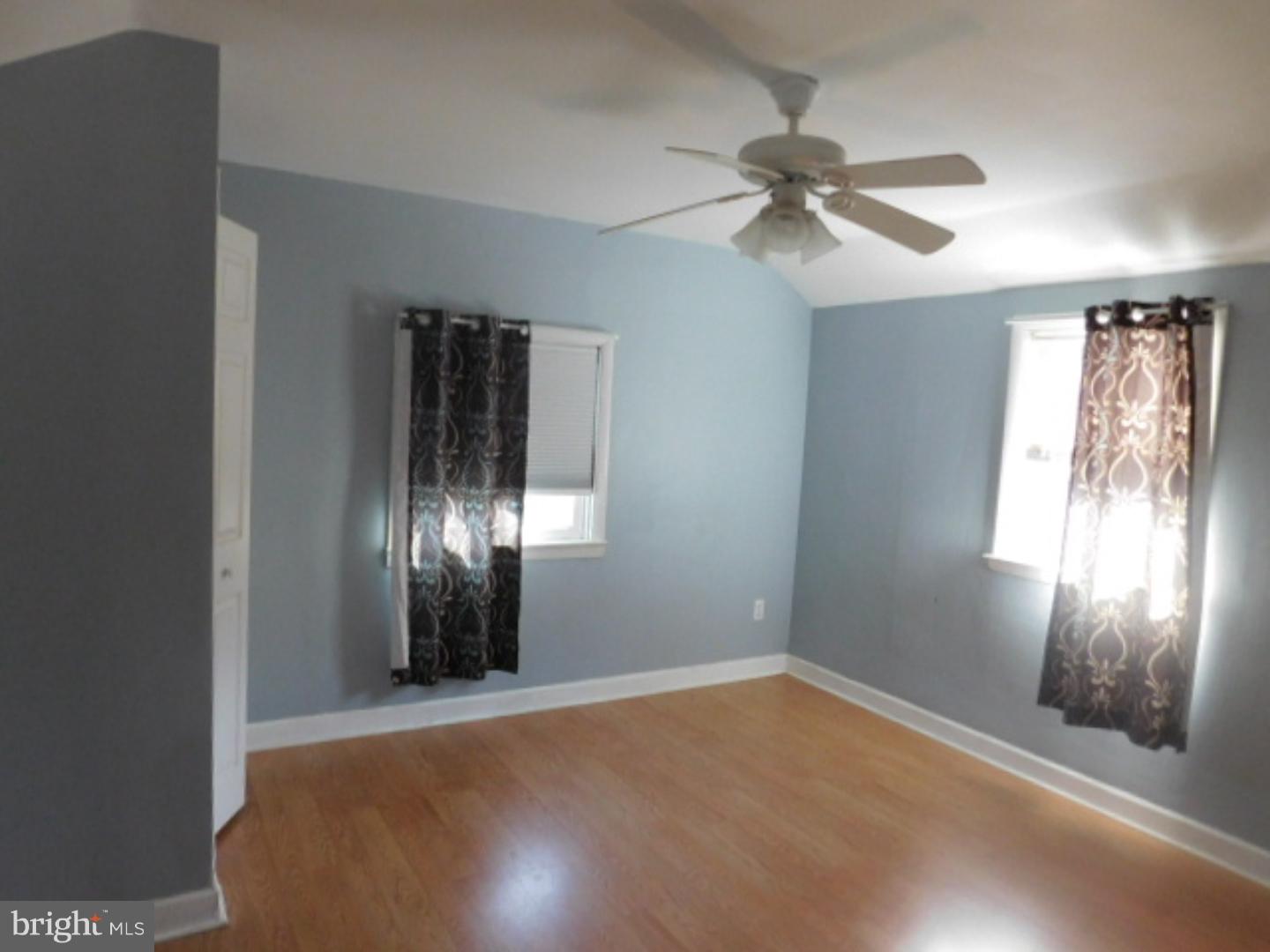2447 Woodland Road Abington, PA 19001 - Photo 13 of 24 an empty room with windows and fan