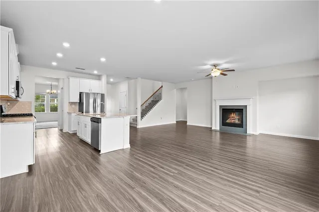 a view of kitchen with furniture and wooden floor