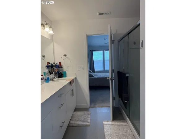 a en suite bathroom with a sink and mirror