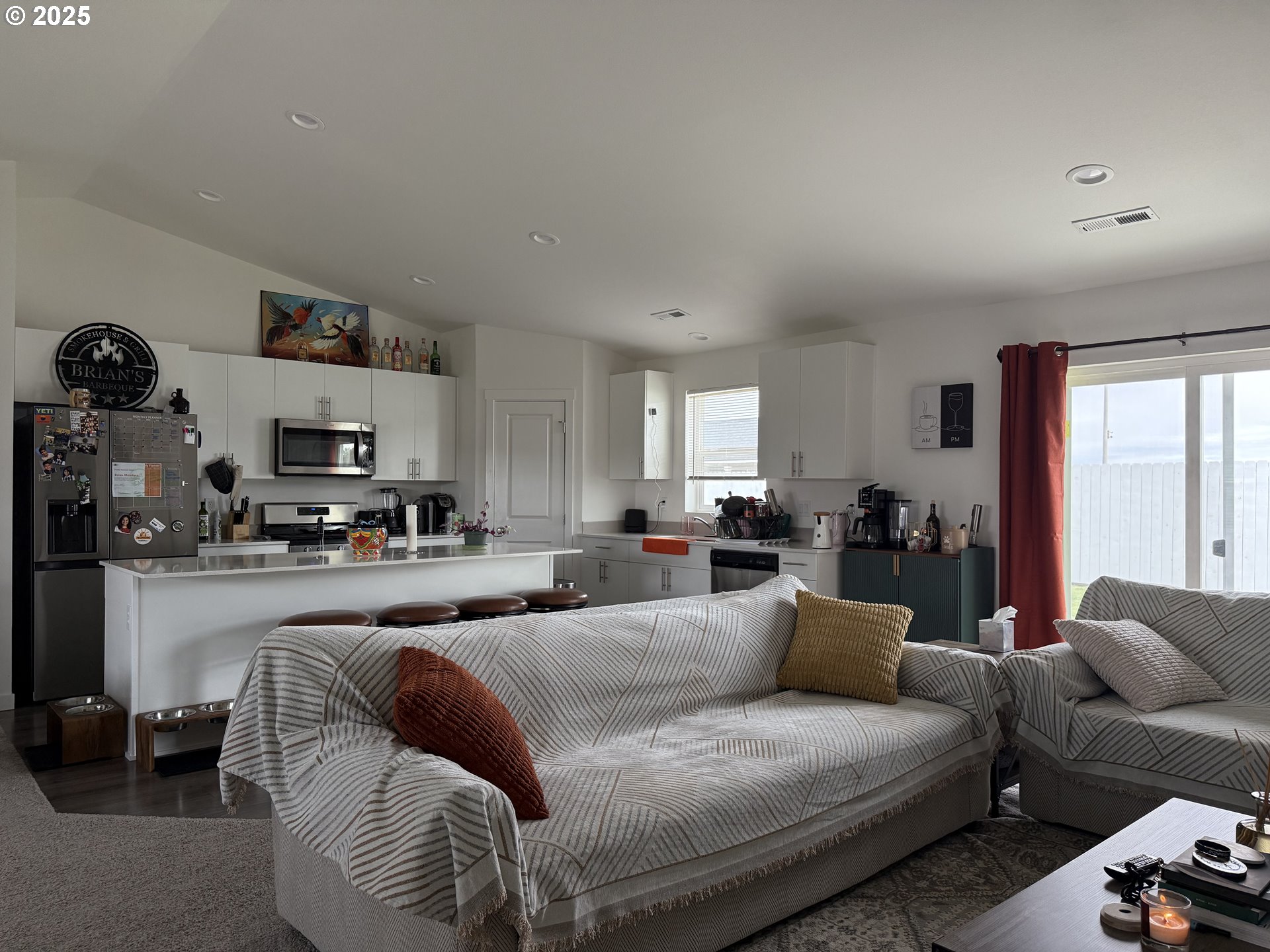 213 River Ridge Drive Boardman, OR 97818 - Photo 2 of 17 a living room with furniture and a flat screen tv