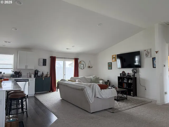 a bedroom with a bed and a television