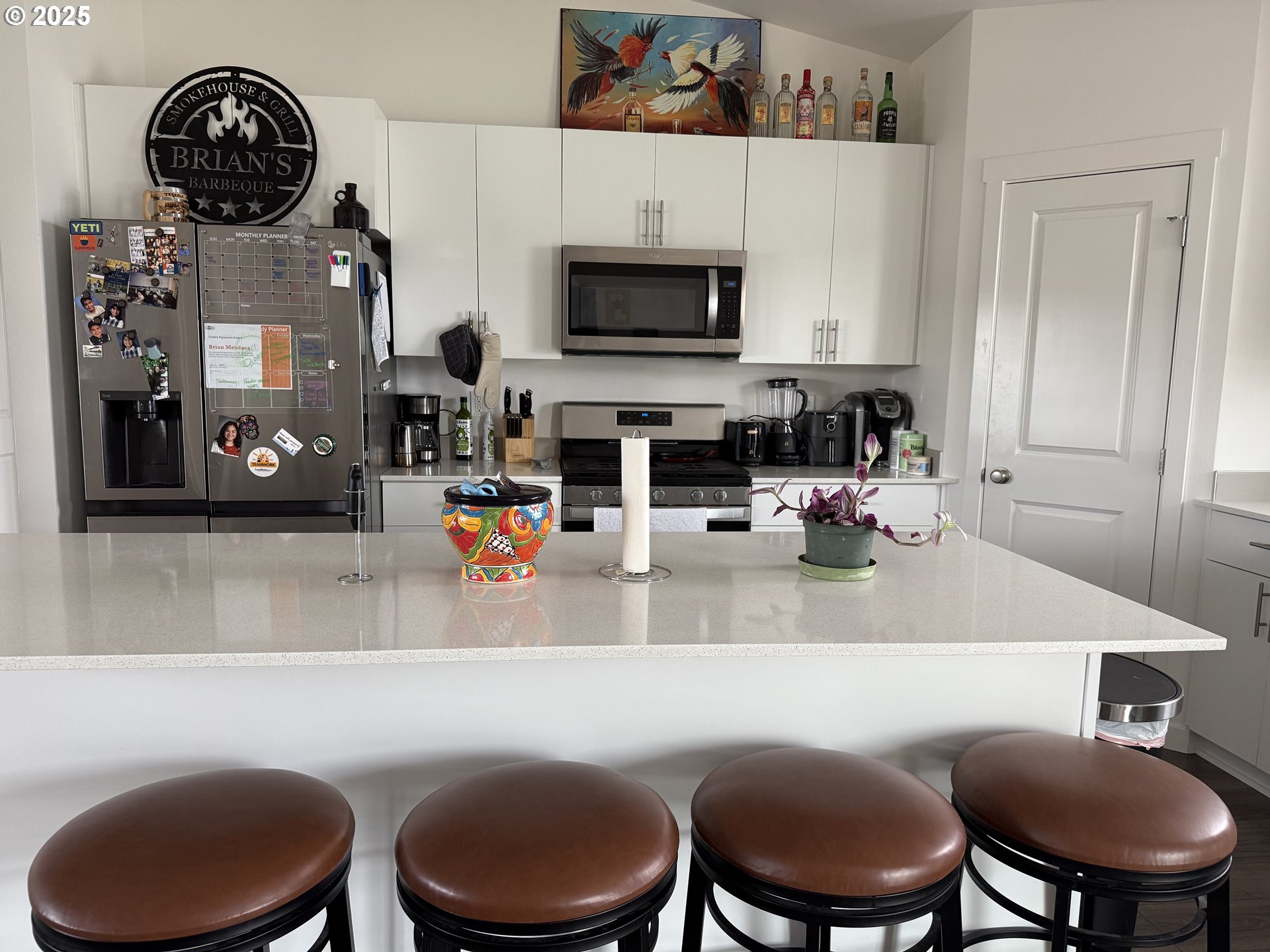 213 River Ridge Drive Boardman, OR 97818 - Photo 5 of 17 a kitchen with a sink a stove and a fireplace