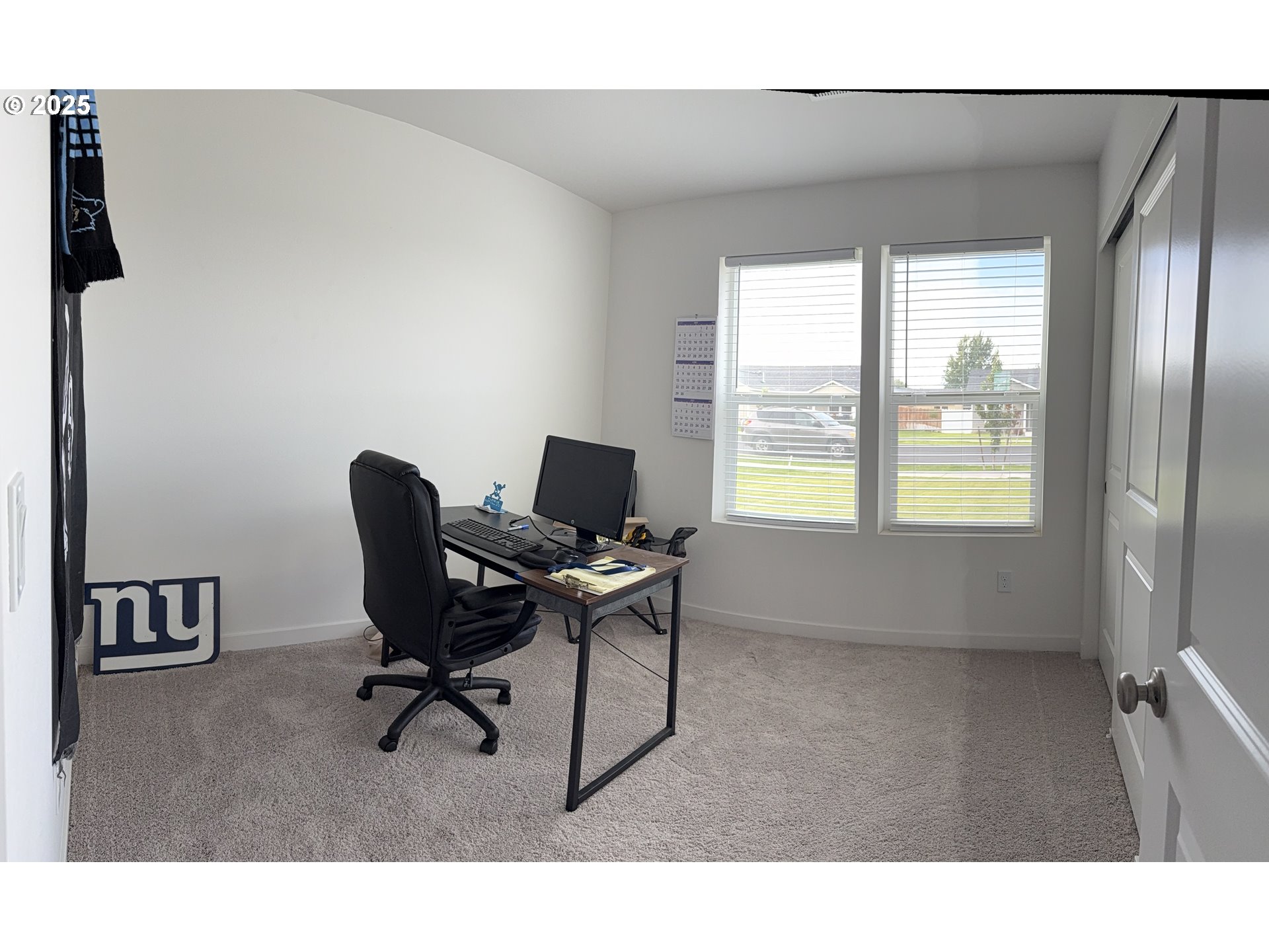 213 River Ridge Drive Boardman, OR 97818 - Photo 8 of 17 a view of a workspace with furniture and a window