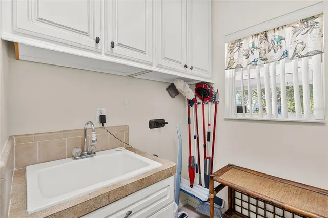 a bathroom with a sink and a window
