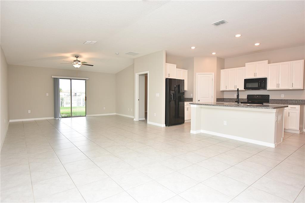 5643 Keaton Springs Drive Lakeland, FL 33811 - Photo 13 of 39 a view of a kitchen with a sink and a refrigerator