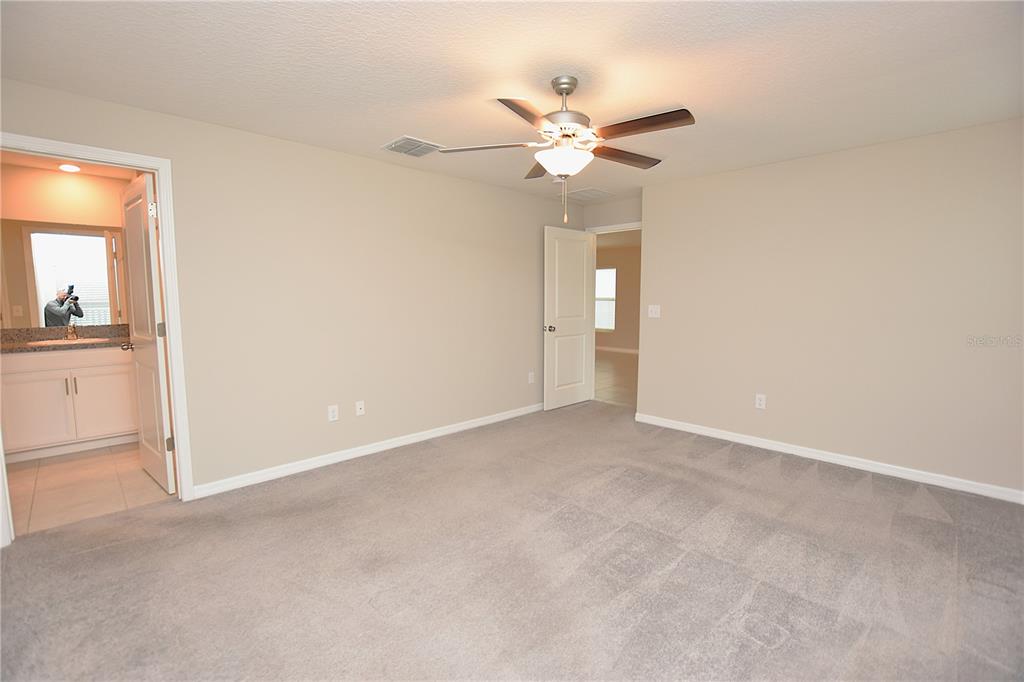 5643 Keaton Springs Drive Lakeland, FL 33811 - Photo 16 of 39 wooden floor in an empty room and a window