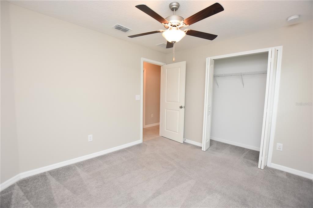 5643 Keaton Springs Drive Lakeland, FL 33811 - Photo 26 of 39 an empty room with a fan and a fan