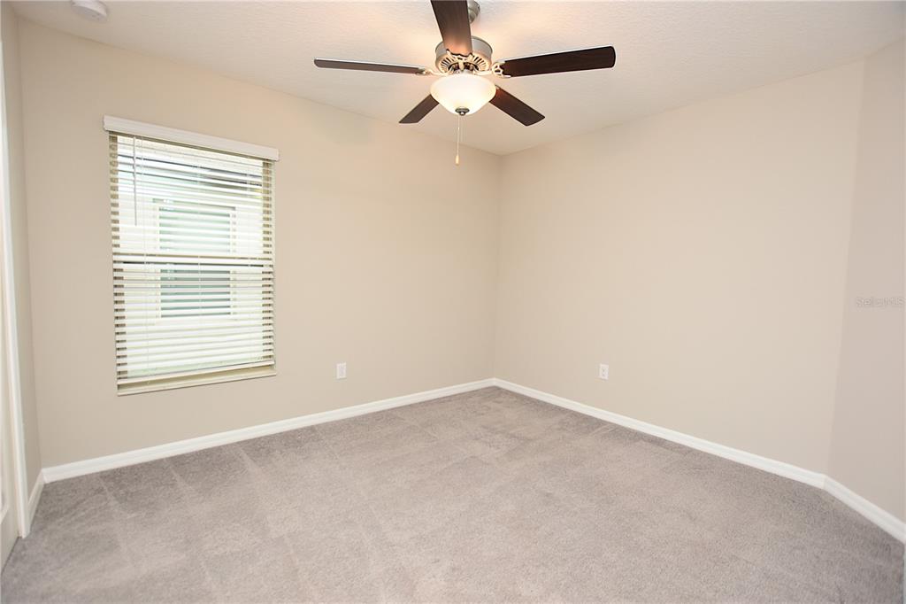5643 Keaton Springs Drive Lakeland, FL 33811 - Photo 27 of 39 an empty room with a window and a fan