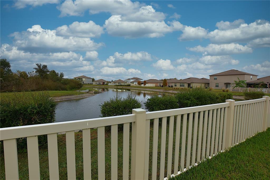 5643 Keaton Springs Drive Lakeland, FL 33811 - Photo 32 of 39 a balcony with wooden floor and lake view
