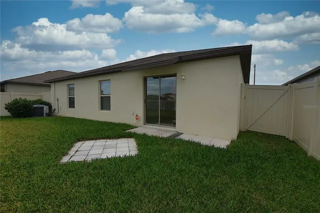 a backyard of a house with lots of green space