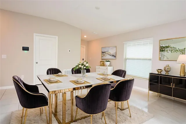 a view of a dining room with furniture