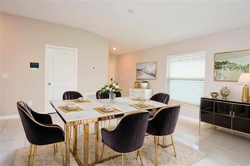 5643 Keaton Springs Drive Lakeland, FL 33811 - Photo 8 of 39 a view of a dining room with furniture