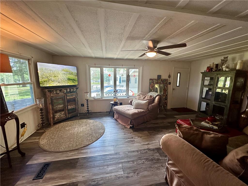 381 Red Oak Lane Bath, PA 18014 - Photo 5 of 27 Plank-style flooring and a ceiling fan create a comfortable atmosphere for everyday living.