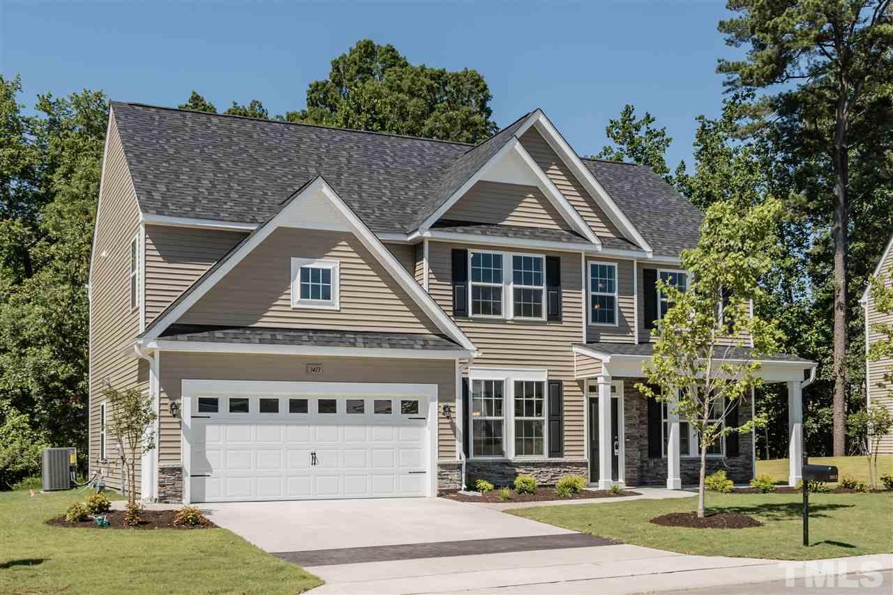3413 Grosbeak Way Raleigh, NC 27616 - Photo 3 of 25 a front view of a house with a yard