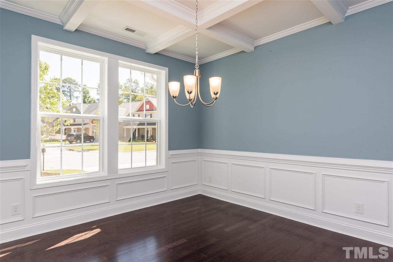 3413 Grosbeak Way Raleigh, NC 27616 - Photo 5 of 25 a view of an empty room with wooden floor and a window