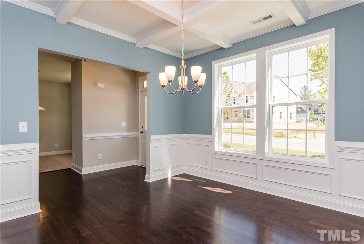 3413 Grosbeak Way Raleigh, NC 27616 - Photo 6 of 25 wooden floor in an empty room with a window
