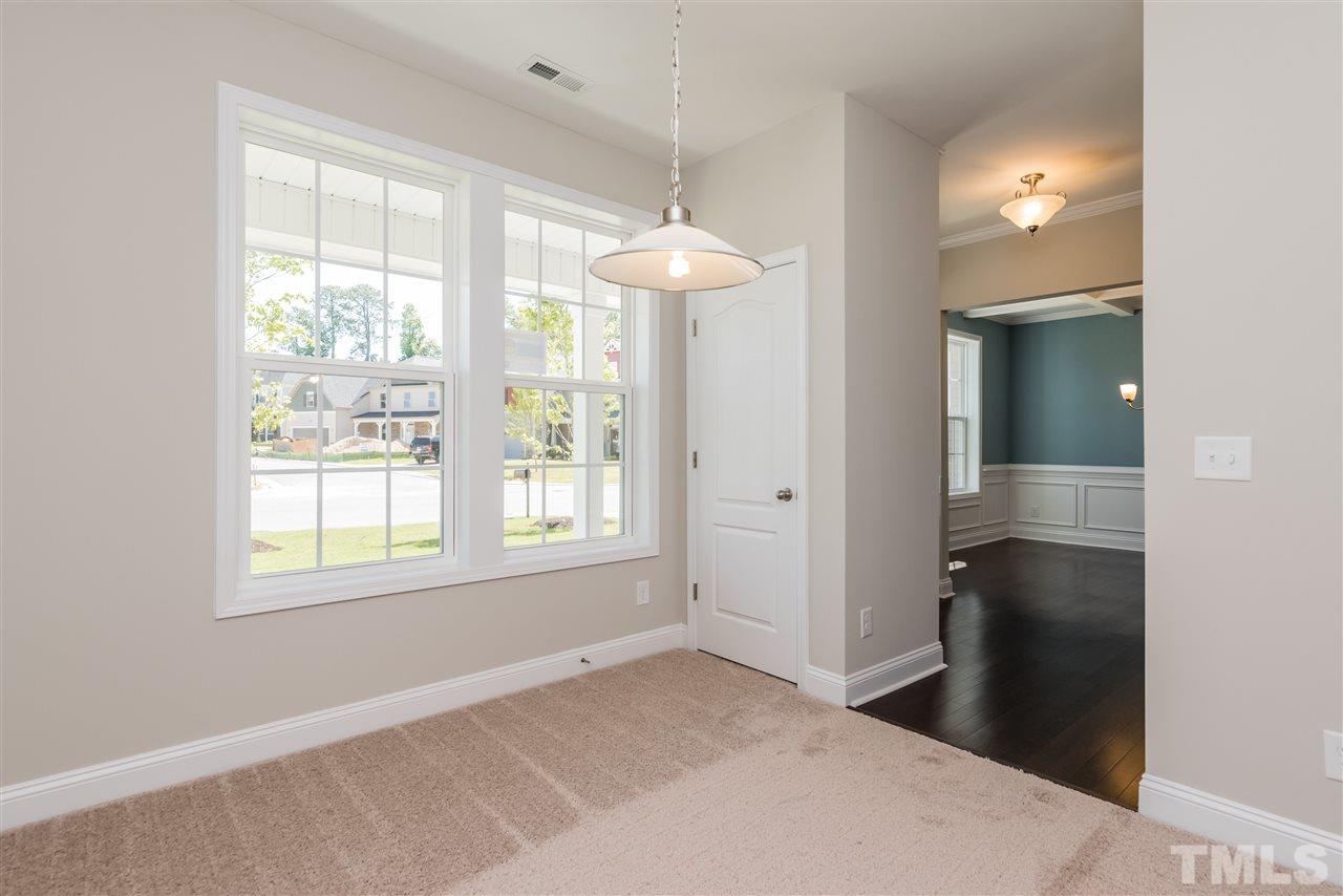 3413 Grosbeak Way Raleigh, NC 27616 - Photo 7 of 25 a view of an empty room with window and bathroom