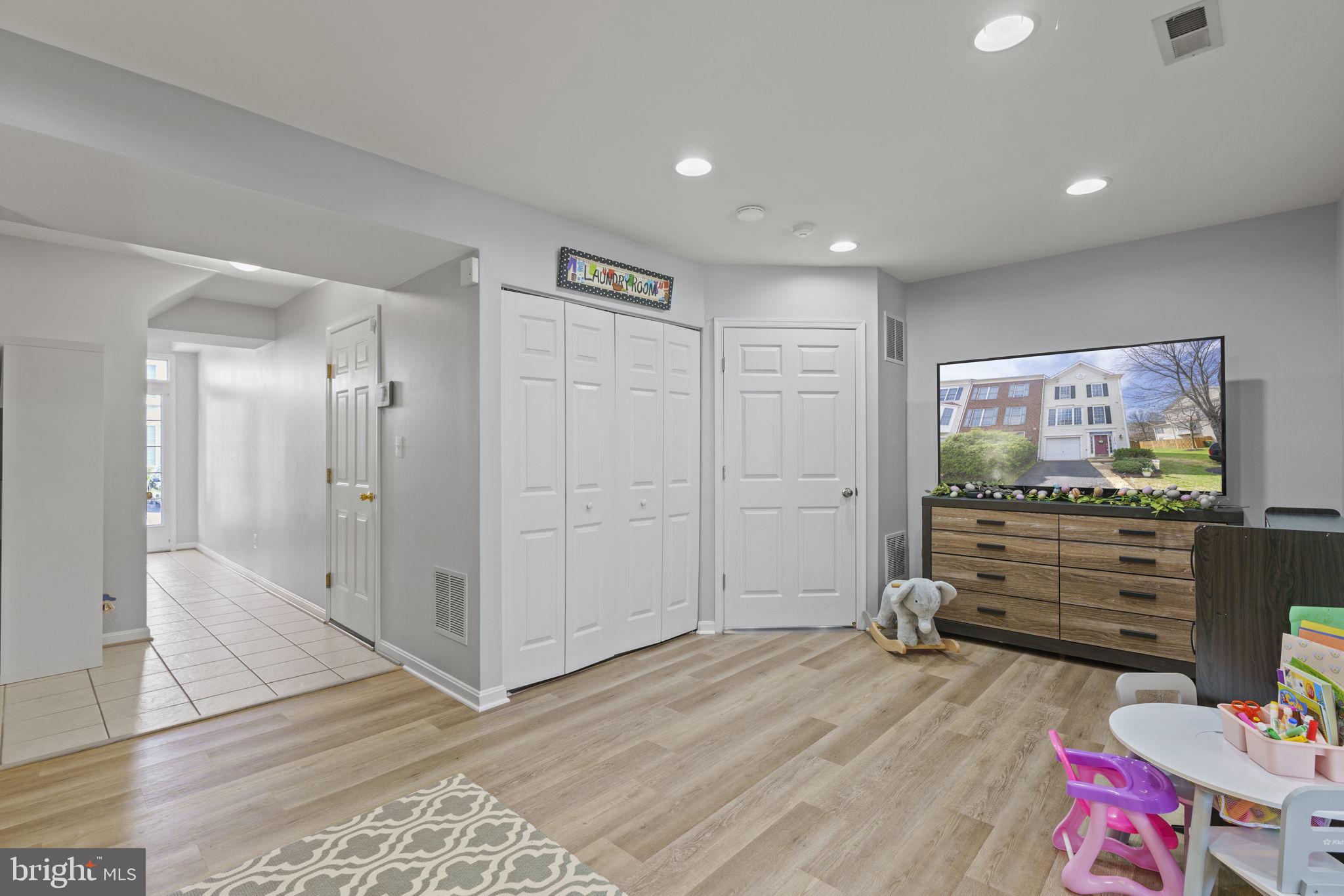 9068 Two Bays Road Lorton, VA 22079 - Photo 3 of 39 Lower level rec room- new flooring