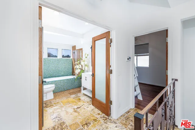 a bathroom with a bathtub sink and toilet