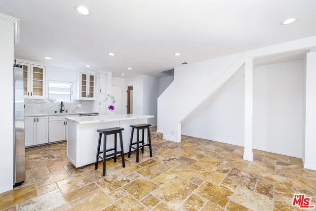 a view of a kitchen and dining room