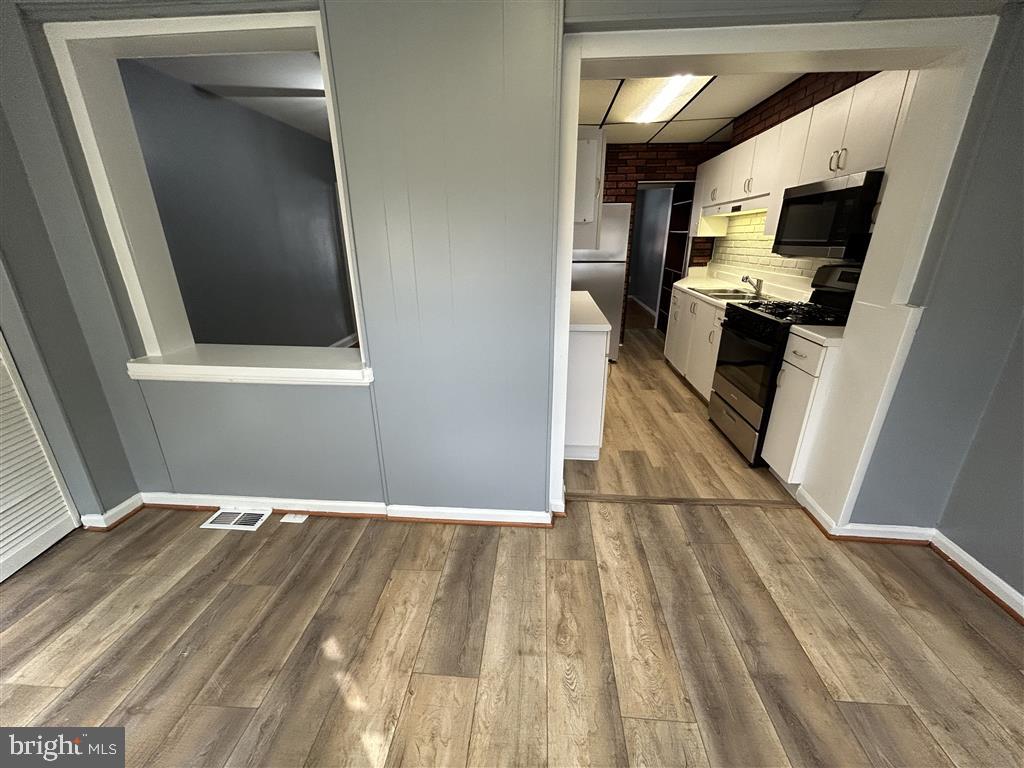 8333 Kavanagh Road Baltimore, MD 21222 - Photo 9 of 30 a view of a kitchen from the hallway