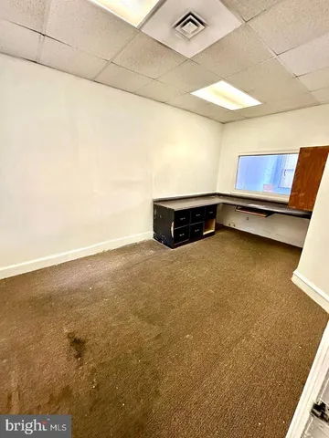 a room with a table and chairs