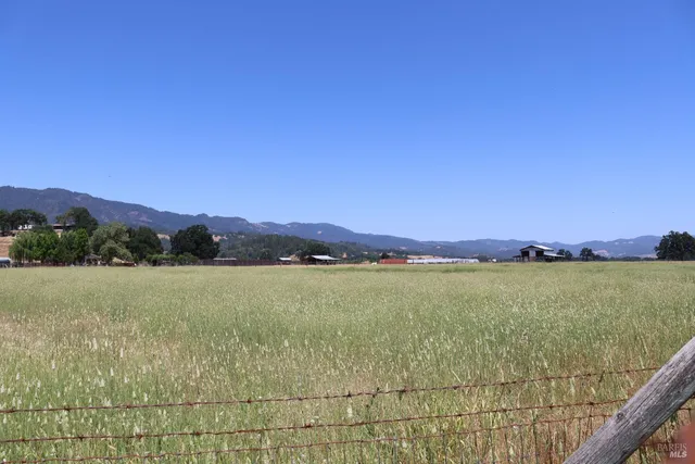 a view of an ocean and a mountain