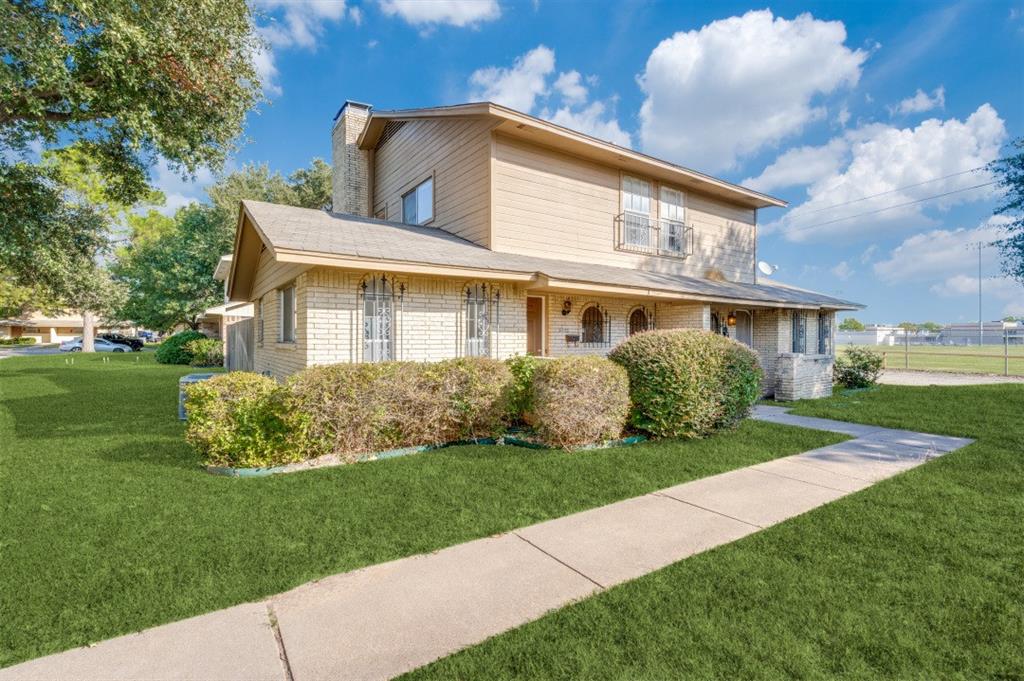 3001 Helmet Street, Unit 3003 Irving, TX 75060 - Photo 1 of 12 a front view of a house with a yard