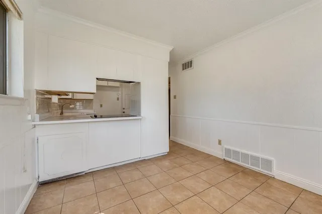 a view of cabinets and window