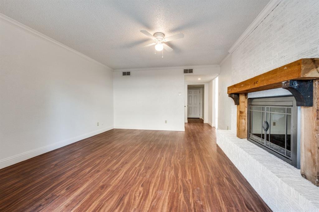 3001 Helmet Street, Unit 3003 Irving, TX 75060 - Photo 2 of 12 wooden floor in an empty room with a window