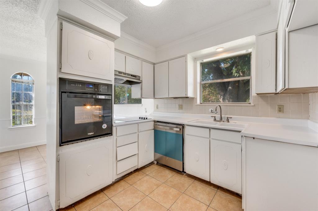 3001 Helmet Street, Unit 3003 Irving, TX 75060 - Photo 4 of 12 a kitchen with a sink stove and microwave
