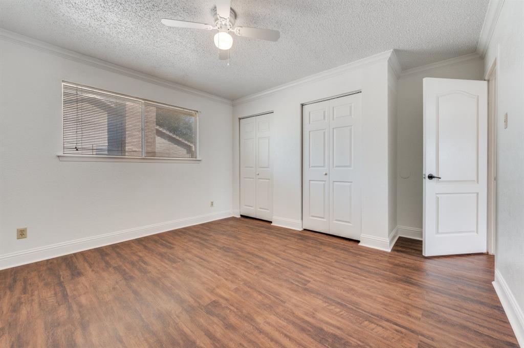 3001 Helmet Street, Unit 3003 Irving, TX 75060 - Photo 6 of 12 a view of an empty room with wooden floor