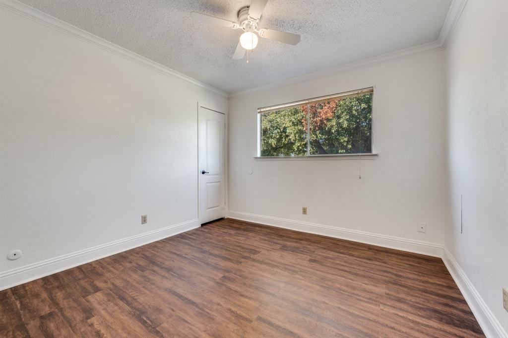 3001 Helmet Street, Unit 3003 Irving, TX 75060 - Photo 7 of 12 wooden floor in an empty room with a window
