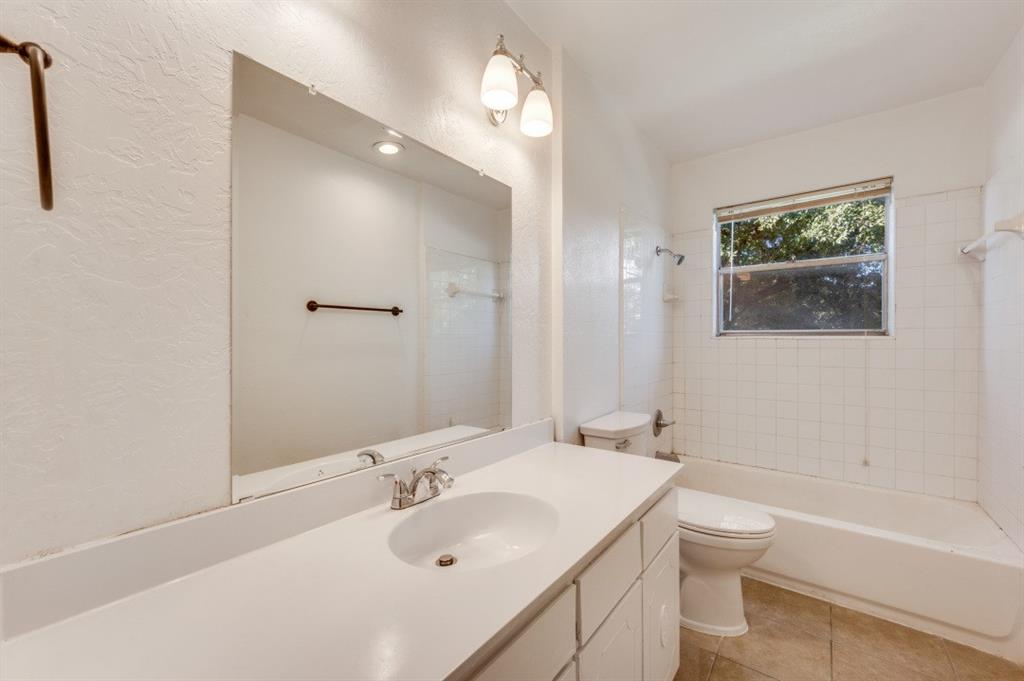 3001 Helmet Street, Unit 3003 Irving, TX 75060 - Photo 8 of 12 a bathroom with a sink toilet and shower