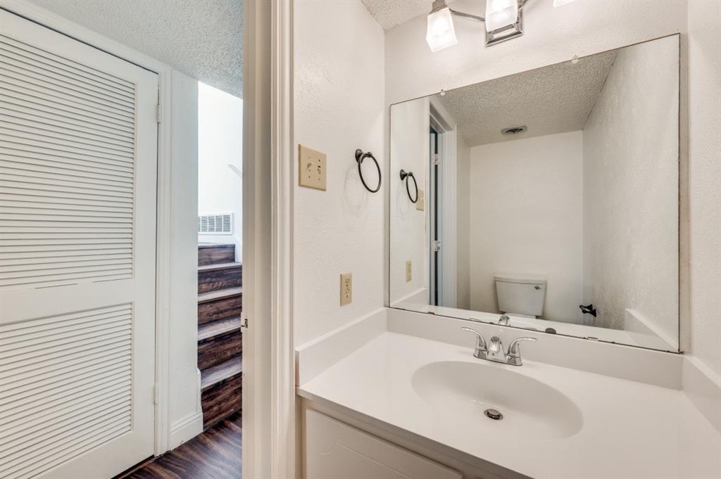 3001 Helmet Street, Unit 3003 Irving, TX 75060 - Photo 9 of 12 a bathroom with a sink and a mirror