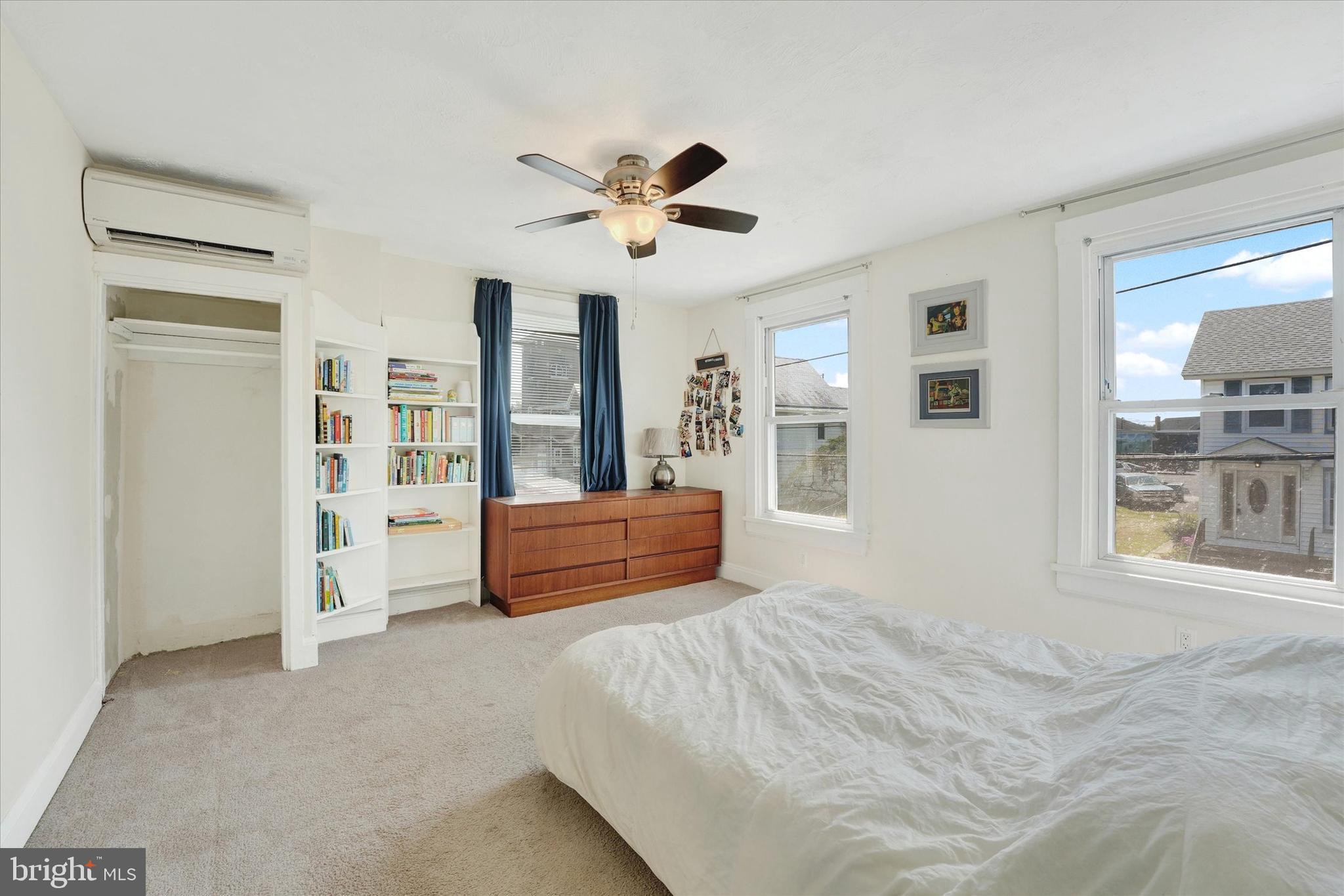 15 North Walnut Street Rising Sun, MD 21911 - Photo 23 of 43 a bedroom with a large bed and a chandelier