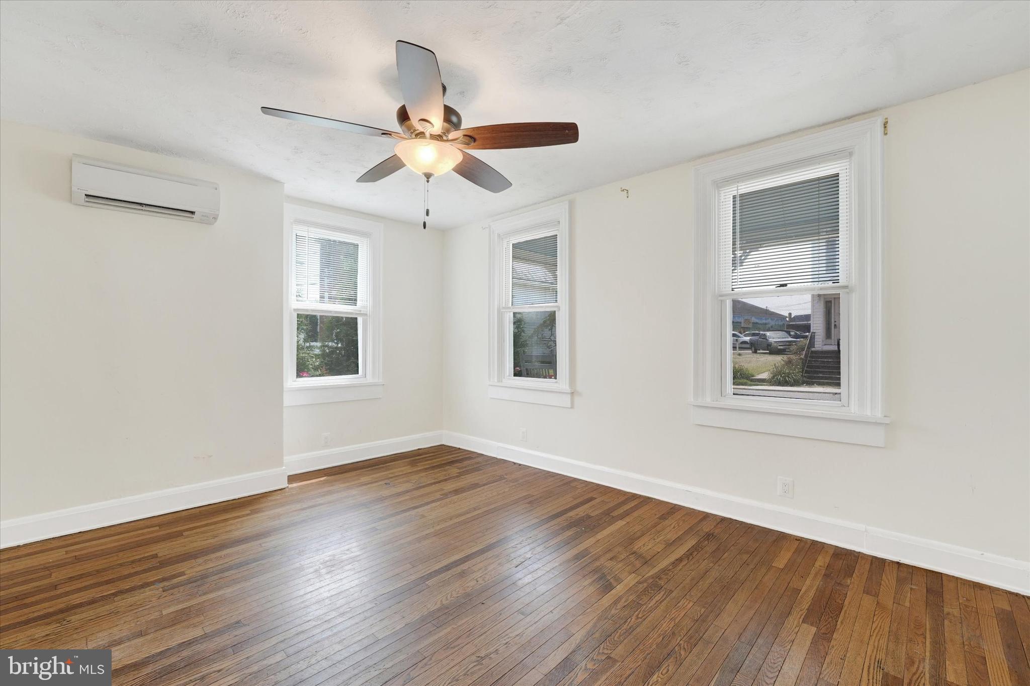 15 North Walnut Street Rising Sun, MD 21911 - Photo 6 of 43 a view of an empty room with wooden floor and a window