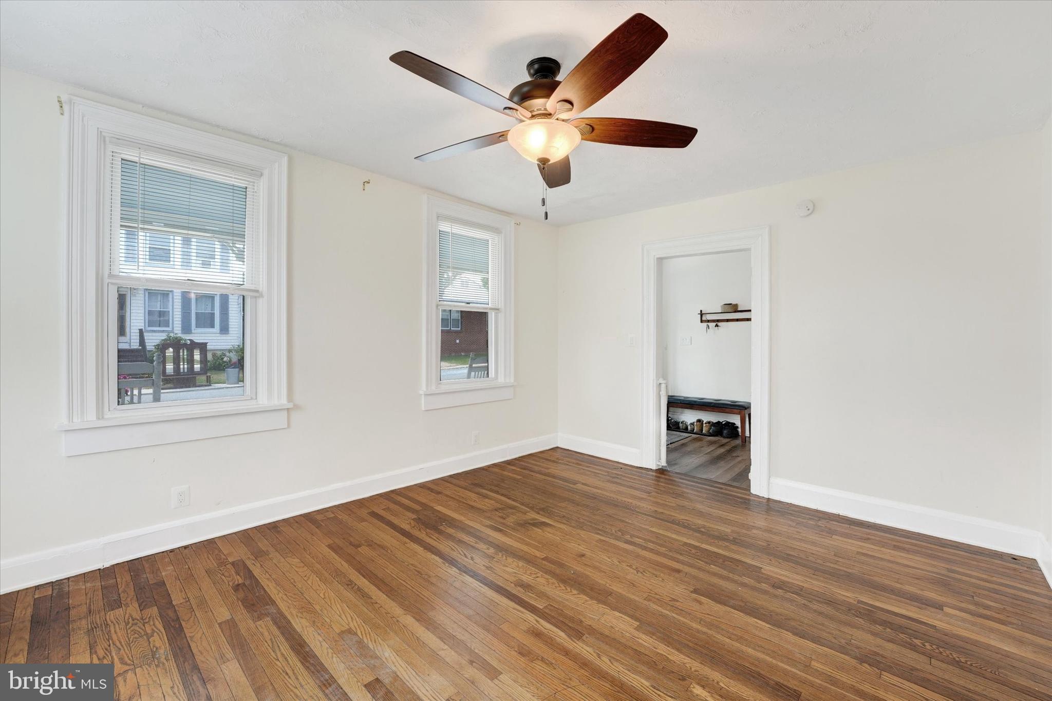 15 North Walnut Street Rising Sun, MD 21911 - Photo 7 of 43 a view of an empty room with a window and wooden floor