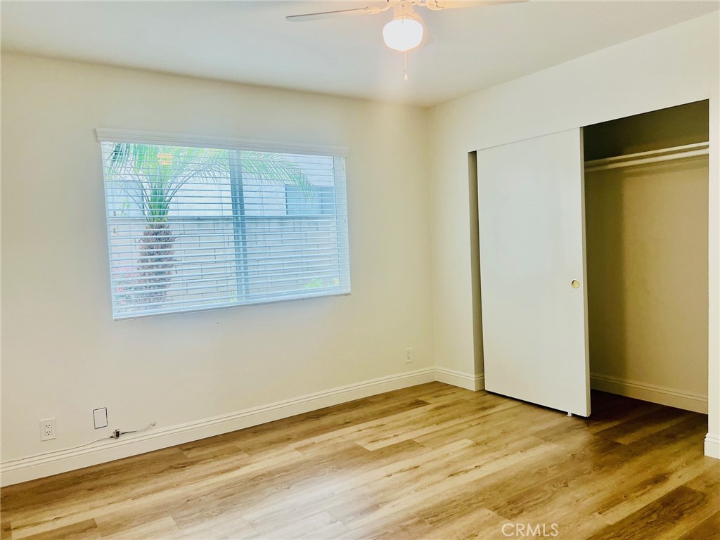 10801 Pine Street Los Alamitos, CA 90720 - Photo 14 of 24 a view of an empty room with wooden floor and a window