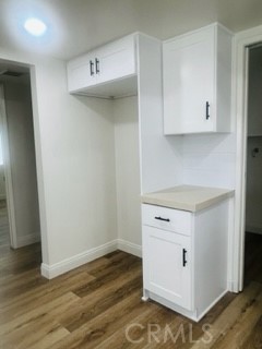 10801 Pine Street Los Alamitos, CA 90720 - Photo 9 of 24 a view of cabinets and wooden floor