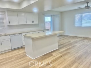10801 Pine Street Los Alamitos, CA 90720 - Photo 10 of 24 a view white cabinets and wooden floor