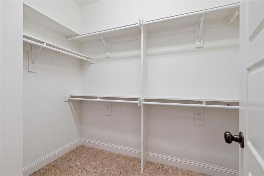 662 Preakness Place Road Van Alstyne, TX 75495 - Photo 18 of 39 a view of an empty walk in closet