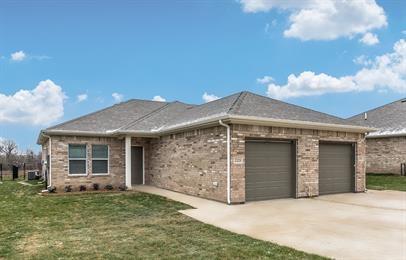 2407 North Hickory Street Sherman, TX 75092 - Photo 1 of 9 a front view of a house with garden