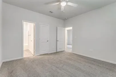 an empty room with a empty space and a ceiling fan