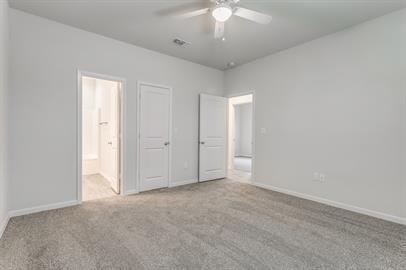 2407 North Hickory Street Sherman, TX 75092 - Photo 4 of 9 an empty room with a empty space and a ceiling fan