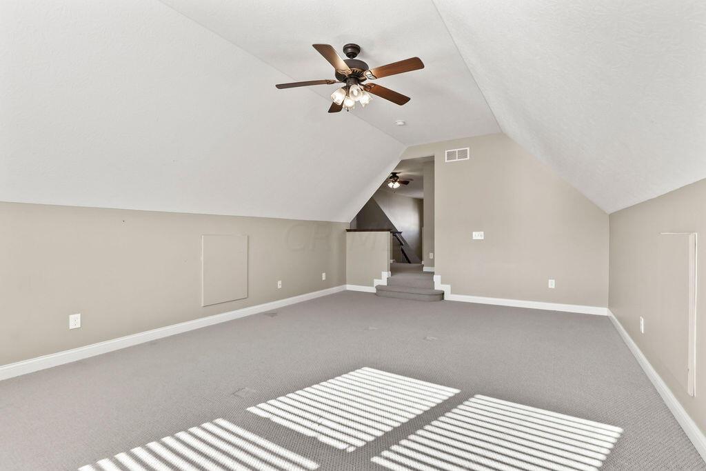 6163 Jennis Road Westerville, OH 43081 - Photo 28 of 44 • Sunken
• Tan carpet
• Tan painted walls
• Angled ceiling
• Lighted ceiling fan
• Attic access
• 2” blinds