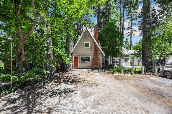 a house with trees in the background