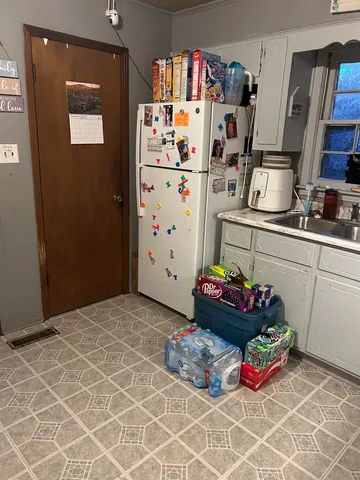 a bedroom with a bed and cabinets