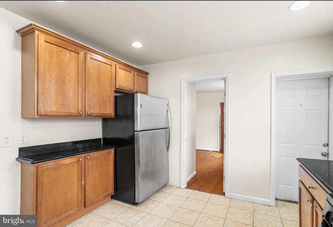 1401 Druid Hill Avenue, Unit A Baltimore, MD 21217 - Photo 9 of 17 a kitchen with a refrigerator and a sink